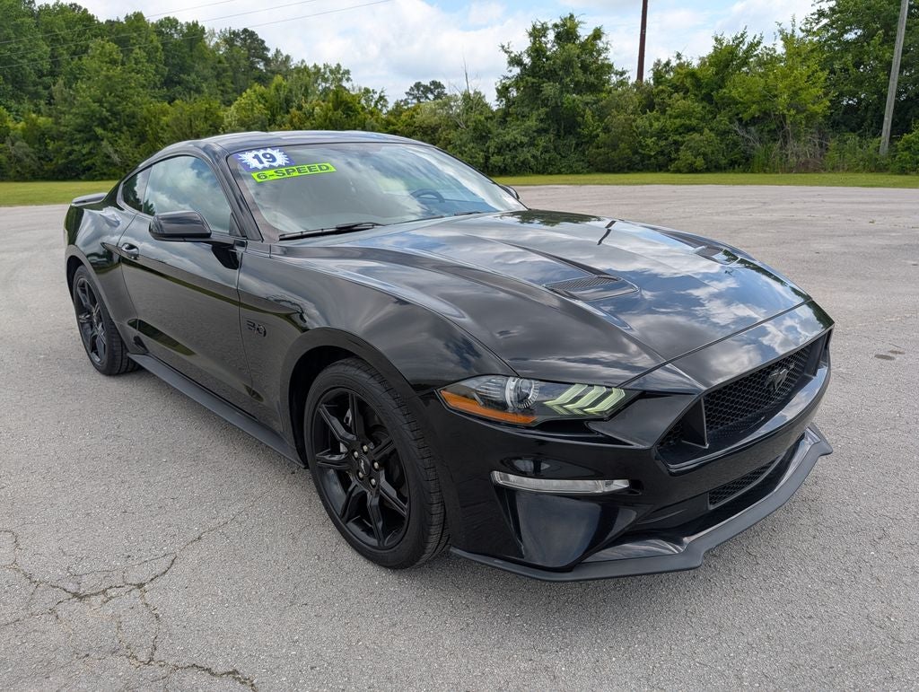 2019 Ford Mustang GT in Shadow Black — front three-quarter view