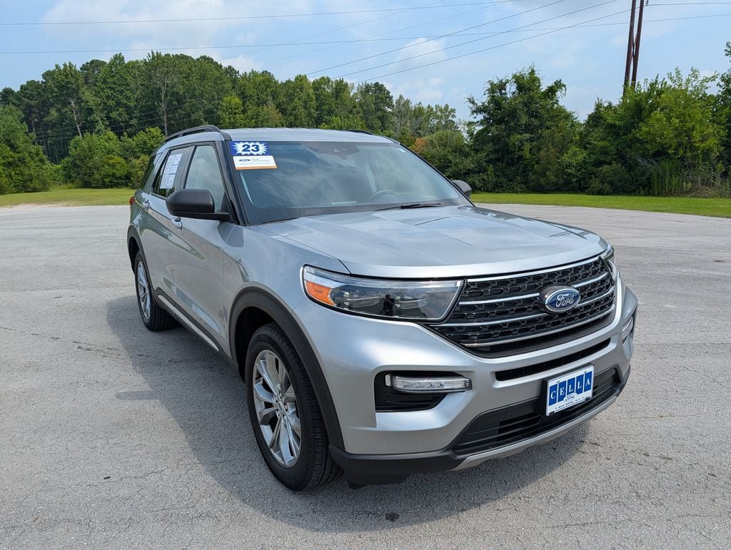 2023 Ford Explorer XLT in Iconic Silver Metallic — front three-quarter view