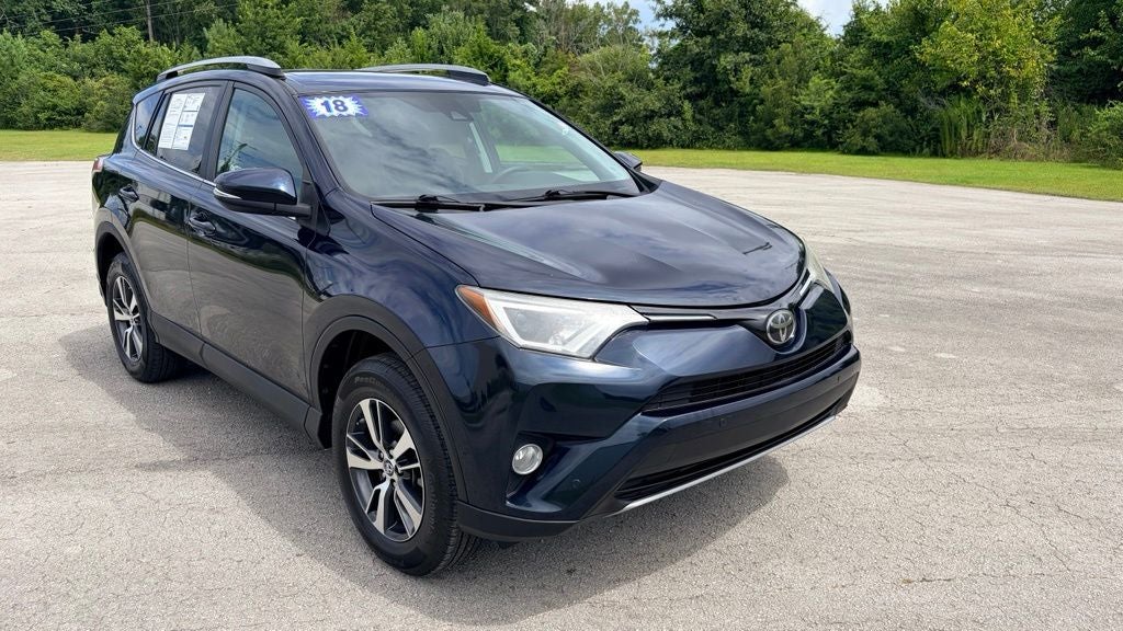 2018 Toyota RAV4 XLE in Galactic Aqua Mica — front three-quarter view